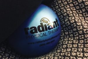 radiant physical therapy logo on therapy ball